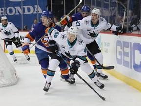 The San Jose Sharks and New York Islanders could easily be the disappointment and surprise teams, respectively, in this spring's playoffs. (Photo by Bruce Bennett/Getty Images)