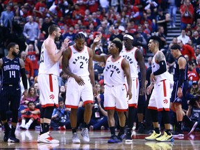 Raptors’ Marc Gasol (left), Kawhi Leonard (centre) and Kyle Lowry celebrate their Game 2 win. Game 3 goes Friday night in Orlando. (GETTY IMAGES)