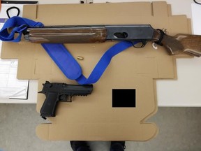 A replica firearm and a prohibited firearm were allegedly seized when officers responded to an unknown trouble call involving a woman, 20, who claimed she was being assaulted by a man near Front and Cooperage Sts. on Monday, April 15, 2019. (Toronto Police handout)