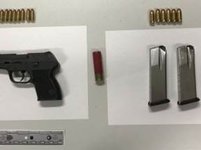 This handgun and ammunition were allegedly seized and three men arrested when cops raided a Rexdale home on Wednesday, April 24, 2019. (Toronto Police handout)