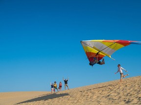 Kitty Hawk Kites takes people out hang gliding near where the Wright Brothers had the world's first four successful motorized airplane flights at Kitty Hawk on North Carolina's Outer Banks. (Kitty Hawks Kites)