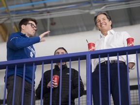 Toronto Maple Leafs general manager Kyle Dubas, left, and president Brendan Shanahan talk during practice on Monday. , April 8, 2019. The Maple Leafs take on the Boston Bruins in the first round of the Stanley Cup playoffs. THE CANADIAN PRESS/Nathan Denette