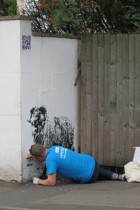 ‘Stewy’, one of 300 artists at the 2018 UpFest in south Bristol – billed as Europe’s biggest street art festival – finishes black-and-white sheep on North St. (Ian Robertson)