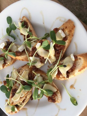 A platter of appetizers — fig and brie crostini with sunflower sprouts — served during a recent desert dinner. ROBIN ROBINSON/SPECIAL TO POSTMEDIA NETWORK