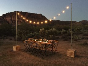 Table set up with lights for a gourmet dinner in the desert near the Superstition Mountains with Cloth & Flame. ROBIN ROBINSON/SPECIAL TO POSTMEDIA NETWORK