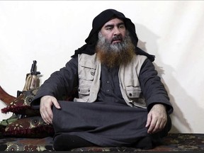 This image made from video posted on a militant website on Monday, April 29, 2019, purports to show the leader of the Islamic State group, Abu Bakr al-Baghdadi, being interviewed by his group's Al-Furqan media outlet. (Al-Furqan media via AP)