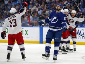 Cedric Paquette of the Tampa Bay Lightning reacts as Cam Atkinson and other Columbus Blue Jackets celebrate a goal during Game 2 of the Eastern Conference playoffs at Amalie Arena on April 12, 2019 in Tampa. (Mike Carlson/Getty Images)