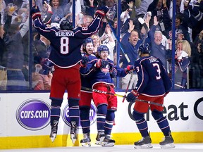 Artemi Panarin of the Columbus Blue Jackets is congratulated by teammates after scoring an empty net goal against the Tampa Bay Lightning on April 16, 2019 at Nationwide Arena in Columbus. (Kirk Irwin/Getty Images)