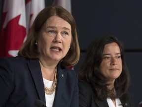 Health Minister Jane Philpott responds to a question as Minister of Justice and Attorney General of Canada Jody Wilson-Raybould looks on during a news conference in Ottawa, Thursday June 30, 2016.