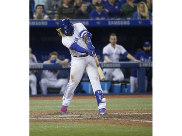 Toronto Blue Jays Vlad Guerrero Jr. 3B (27) hits a grounder for a double In the ninth inning in Toronto, Ont. on Friday April 26, 2019. Jack Boland/Toronto Sun/Postmedia Network