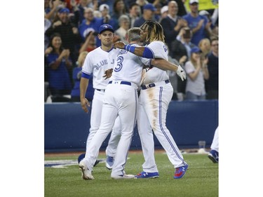 Toronto Blue Jays Brandon Drury 3B (3) is congratulated by Toronto Blue Jays Vlad Guerrero Jr. 3B (27) after hitting a two-run homer In the ninth inning in Toronto, Ont. on Friday April 26, 2019. Jack Boland/Toronto Sun/Postmedia Network