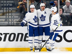 Maple Leafs' Mitchell Marner (left), John Tavares and Nikita Zaitsev celebrate a goal against the Bruins during Game 1 on Thursday night in Boston. (GETTY IMAGES)