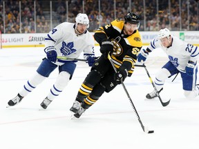 Bruins forward Sean Kuraly carries the puck against the Maple Leafs during Game 7 of their series on Tuesday night in Boston. Toronto lost 5-1. (Maddie Meyer/Getty Images)