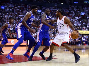 Raptors star Kawhi Leonard gets double-teamed by the Philadelphia 76ers on Monday night in Toronto. (Vaughn Ridley/Getty Images)