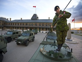 Cpl. Hope Mosco of Windsor prepares her vehicle for urban operations by tieing down the whip antenna on a Canadian Armed Forces G wagon at Wolsely barracks in London, Ont. A large urban exercise is being carried out this weekend in southwestern Ontario with all the command and support operations being set up at Wolsely Barracks. The exercise is a simulated domestic emergency like major flooding, or an ice storm or tornado. Over 600 soldiers from 31 Canadian Brigade Group will conduct the exercise. the aim of the exercise is to practice the planning and execution of domestic support operations, so large tents and trucks are being set up to hold the command centres for planning, logistics and supplies. Photograph taken on Friday April 26, 2019. Mike Hensen/The London Free Press/Postmedia Network