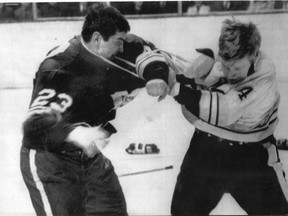 Toronto Maple Leafs' Pat Quinn (23) and Boston Bruins' Bobby Orr (4) going at each other. (Postmedia files)