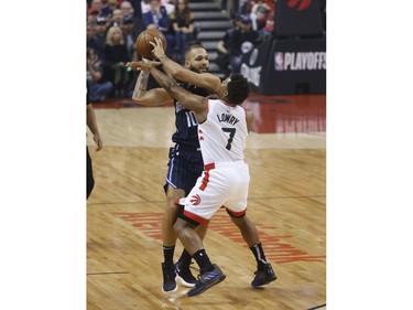 Toronto Raptors Kyle Lowry PG (7)guards Orlando Magic Evan Fournier SG (10) during the first quarter  in Toronto, Ont. on Wednesday April 17, 2019. Jack Boland/Toronto Sun/Postmedia Network