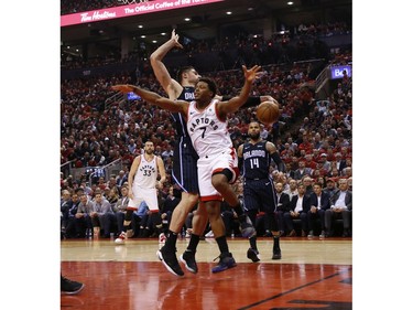 Orlando Magic Nikola Vucevic C (9) fouls Toronto Raptors Kyle Lowry PG (7) during the second quarter  in Toronto, Ont. on Wednesday April 17, 2019. Jack Boland/Toronto Sun/Postmedia Network