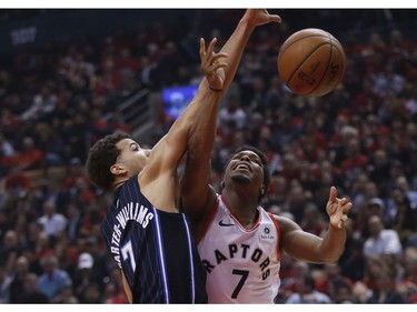 Toronto Raptors Kawhi Leonard SF (2) is doubled teamed by Orlando Magic Michael Carter-Williams PG (7) during the second quarter  in Toronto, Ont. on Tuesday April 16, 2019. Jack Boland/Toronto Sun/Postmedia Network
