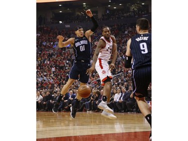 Toronto Raptors Kawhi Leonard SF (2) outlets a pass past Orlando Magic Aaron Gordon PF (00) during the second quarter  in Toronto, Ont. on Wednesday April 17, 2019. Jack Boland/Toronto Sun/Postmedia Network