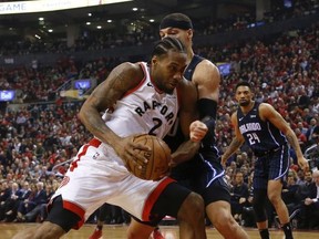 Toronto Raptors Kawhi Leonard SF (2) drives in on Orlando Magic Aaron Gordon PF (00) during the second quarter  in Toronto, Ont. on Wednesday April 17, 2019. Jack Boland/Toronto Sun/Postmedia Network