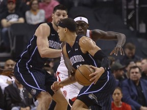 Magic’s Aaron Gordon (front) tries to get around the Raptors’ Pascal Siakam during the second quarter at Scotiabank Arena last night.  Jack Boland/Toronto Sun