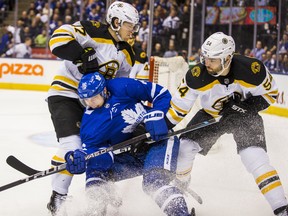 Maple Leafs winger Mitch Marner is sandwiched between the Bruins' Torey Krug (left) and Adam McQuaid during the playoffs last season. (Ernest Doroszuk/Toronto Sun)