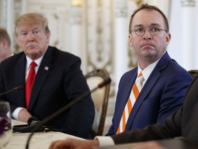 U.S. President Donald Trump (left) and acting White House chief of staff Mick Mulvaney (right), sit together during a meeting with Caribbean leaders at Mar-A Lago, March 22, 2019, in Palm Beach, Fla.