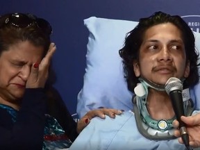 Navindra Sookramsingh, 21, wearing a neck brace, speaks about the hit-and-run March 21, 2019 that left him broken as his mother wipes a tear on April 25, 2019.