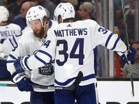 Auston Matthews of the Toronto Maple Leafs celebrates with Jake Muzzin after scoring against the Boston Bruins during Game 5 at TD Garden on April 19, 2019 in Boston. (Maddie Meyer/Getty Images)