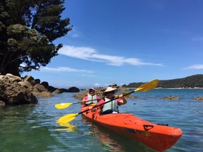 Toronto Sun writer Sue-Ann Levy (back) and her wife, Denise, kayak through the spectacular Abel Tasman Park during a recent trip to New Zealand. (supplied photo)