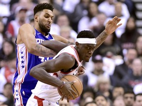 Raptors forward Pascal Siakam (right) fends off Philadelphia 76ers forward Jonah Bolden during the first half of Game 1 on Saturday. Siakam hit 12 of 15 shots, including three three-pointers, on the way to 29 points and seven rebounds. (Frank Gunn/The Canadian Press)