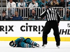 Joe Pavelski of the San Jose Sharks lies on the ice after a hard hit at SAP Center on April 23, 2019 in San Jose. (Ezra Shaw/Getty Images)