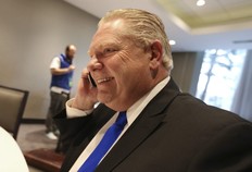Doug Ford on the phone at the Ontario PC leadership convention on Saturday March 10, 2018.