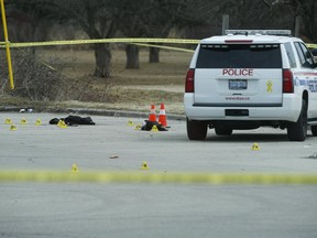 A jacket and other clothing lay on the ground as Durham Regional Police investigate a deadly shooting in a parking lot east of the Pickering Recreational Complex on Sunday, April 7, 2019. (Jack Boland/Toronto Sun/Postmedia Network)