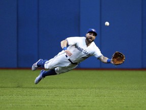 Former Blue Jays outfielder Kevin Pillar makes one of his patented catches. VERONICA HENRI/TORONTO SUN FILE