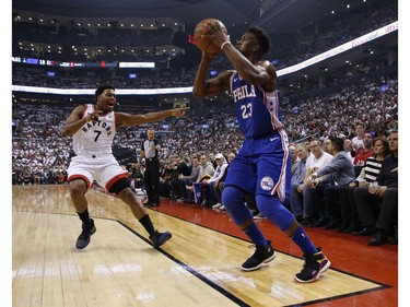 Philadelphia 76ers Jimmy Butler SG (23) steps out of bounds and Toronto Raptors Kyle Lowry PG (7) points it out during the first half in Toronto, Ont. on Saturday April 27, 2019. Jack Boland/Toronto Sun/Postmedia Network