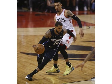 Orlando Magic D.J. Augustin PG (14) goes around Toronto Raptors Danny Green SG (14) during the first half in Toronto, Ont. on Tuesday April 23, 2019. Jack Boland/Toronto Sun/Postmedia Network