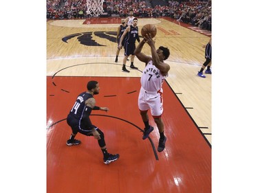 Toronto Raptors Kyle Lowry PG (7) shoots past Orlando Magic D.J. Augustin PG (14) during the first half in Toronto, Ont. on Tuesday April 23, 2019. Jack Boland/Toronto Sun/Postmedia Network