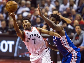 Toronto Raptors guard Kyle Lowry puts up a shot as Philadelphia 76ers' Joel Embiid defends during Game 2 of the Eastern Conference semifinals at the Scotiabank Arena in Toronto on Monday, April 29, 2019. (Ernest Doroszuk/Toronto Sun)