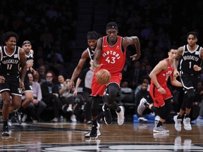 Toronto Raptors forward Pascal Siakam, center, dribbles the ball down court during the first half of an NBA basketball game Wednesday, April 3, 2019, in New York. (AP Photo)