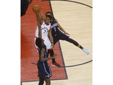 Toronto Raptors Kyle Lowry PG (7) tries to flip a pass over Orlando Magic Jonathan Isaac PF (1) during the second quarter in Toronto, Ont. on Saturday April 13, 2019. Jack Boland/Toronto Sun/Postmedia Network