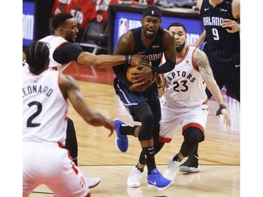 Toronto Raptors Norman Powell SF (24) reaches in on Orlando Magic Terrence Ross SG (31) during the first quarter in Toronto, Ont. on Saturday April 13, 2019. Jack Boland/Toronto Sun/Postmedia Network