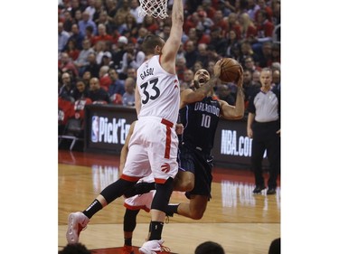 Toronto Raptors Marc Gasol C (33) guards against Orlando Magic Evan Fournier SG (10) during the first quarter in Toronto, Ont. on Saturday April 13, 2019. Jack Boland/Toronto Sun/Postmedia Network