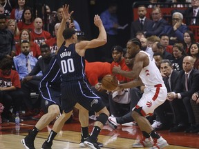 Raptors’ Kawhi Leonard (right) is double-teamed by the Magic on Saturday at Scotiabank Arena. Despite winning Game 1, Magic players say they are not going to get to over confident heading into Game 2 on Tuesday.  Jack Boland/Toronto Sun