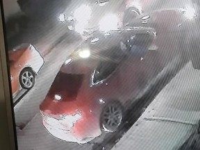 This red, four-door, newer model Lexus sedan is sought in connection with an early morning shooting that injured a man, 25, in the city's Fashion District. (Toronto Police handout)