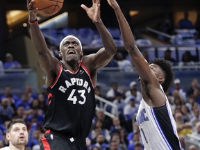 Toronto’s Pascal Siakam (left) is now averaging 24.5 points, 10 rebounds and three assists through three games against the Orlando Magic and has turned the ball over only once. He also averages 40 minutes a night. AP