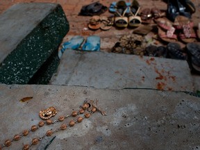 Footwear and personal belongs of victims kept close to the scene of a suicide bombing at St. Sebastian Church in Negombo, Sri Lanka, Monday, April 22, 2019.