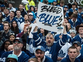Fans react at a Playoff Tailgate Party in Maple Leaf Square during game six of the NHL Stanley Cup playoff series between the Toronto Maple Leafs and the Washington Capitals in Toronto on Sunday, April 23, 2017. THE CANADIAN PRESS/Aaron Vincent Elkaim)