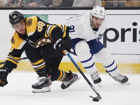 Bruins forward David Pastrnak (left) battles Maple Leafs centre John Tavares during Game 5 of thier first-round playoff series on Friday in Boston. Game 6 is Sunday afternoon in Toronto. (Michael Dwyer/The Associated Press)